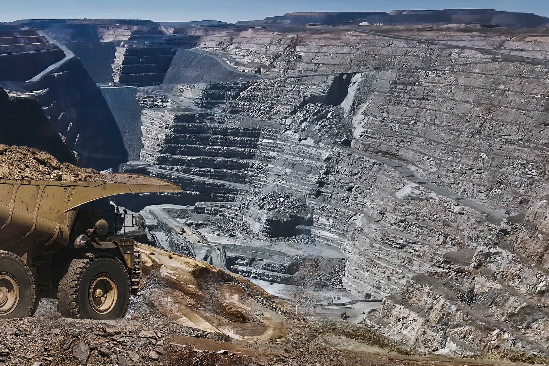 Aerial view of a wheel loader working an ore stockpile